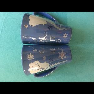 A pair of Disney mugs